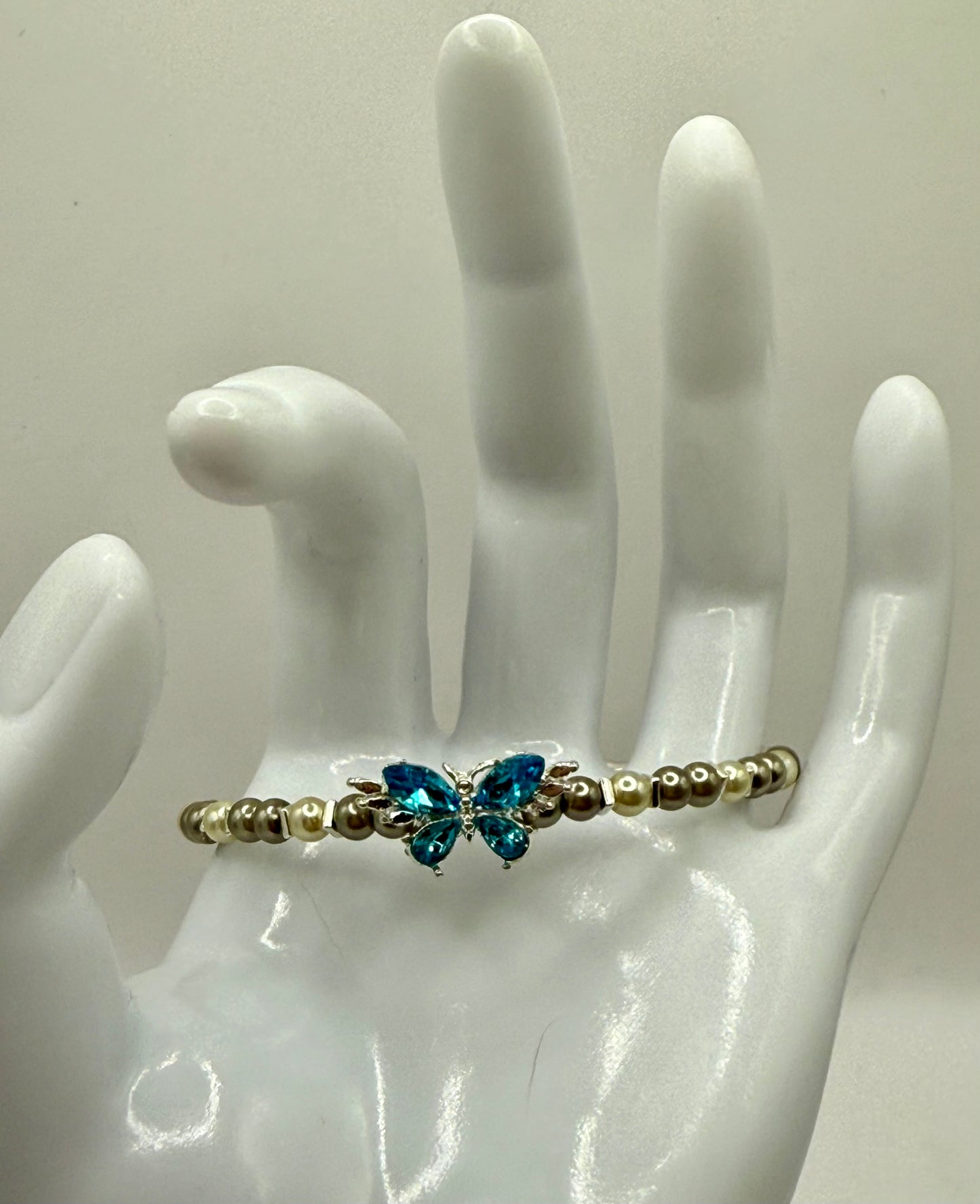 7.5” Ivory & Olive Glass Pearl Bracelet with Blue Butterfly Focal – Nature-Inspired Jewelry