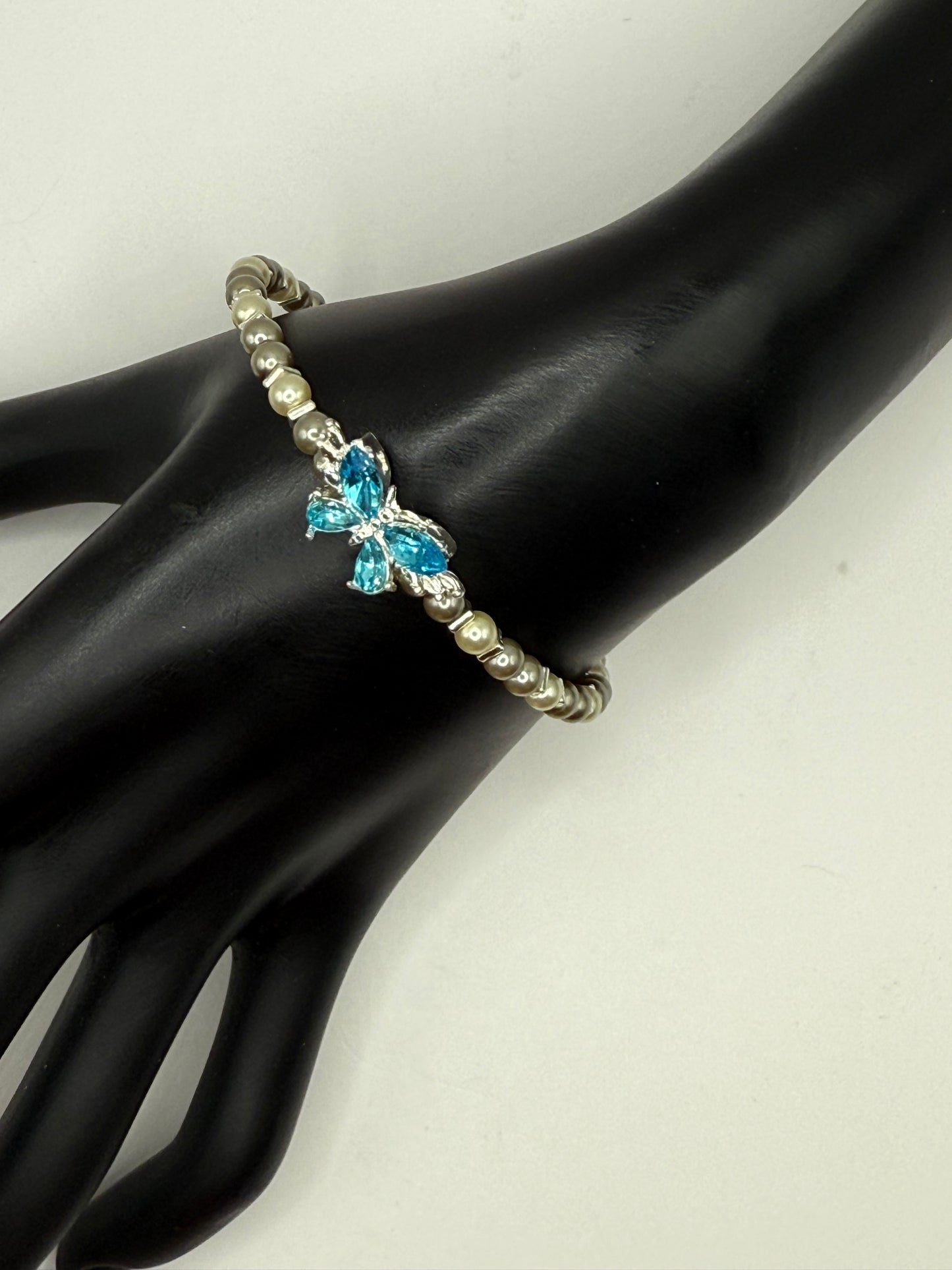 7.5” Ivory & Olive Glass Pearl Bracelet with Blue Butterfly Focal – Nature-Inspired Jewelry