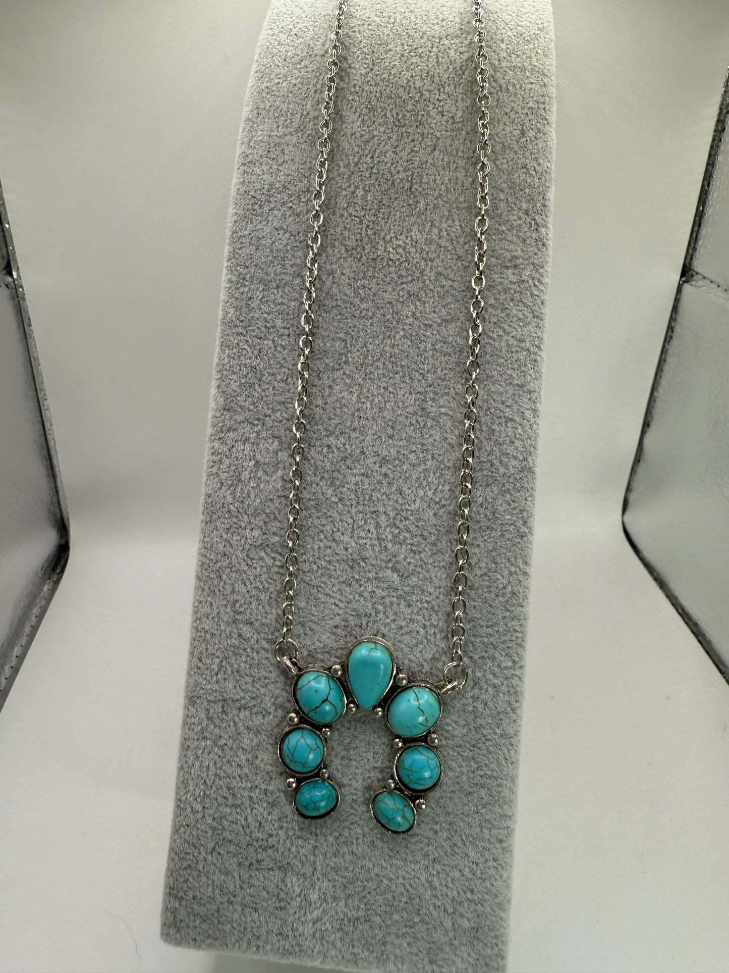 Turquoise Howlite Squash Blossom Necklace ā 18ā Silver Chain