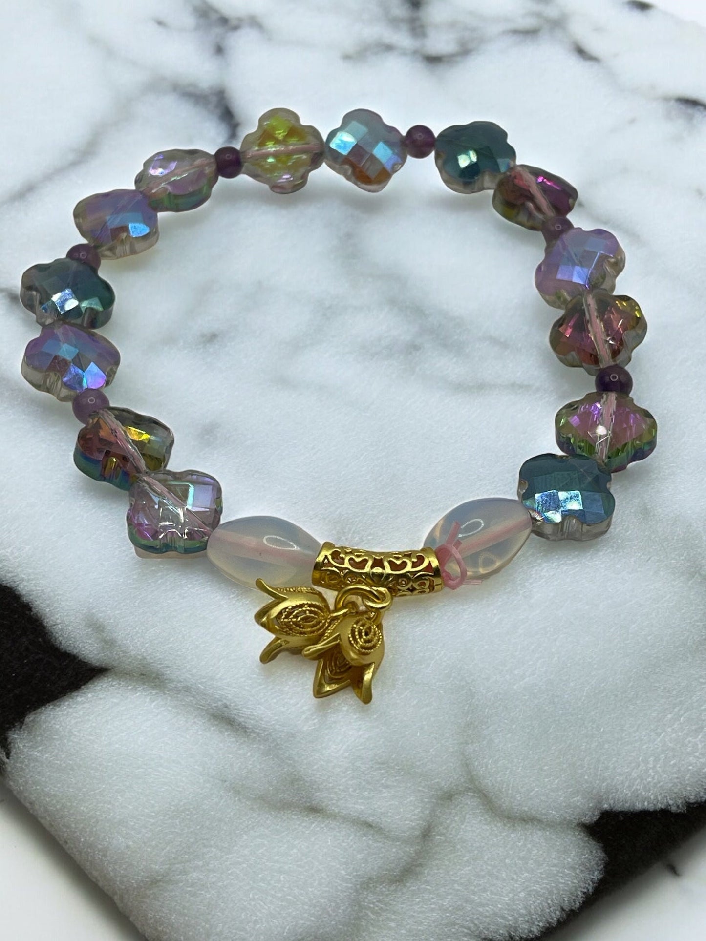 Lucky clover shaped multi-colored faceted cut bracelet with gold dangle floral charm 7.5"