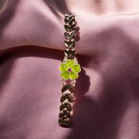 Black V shaped bracelet with green floral focal 7"