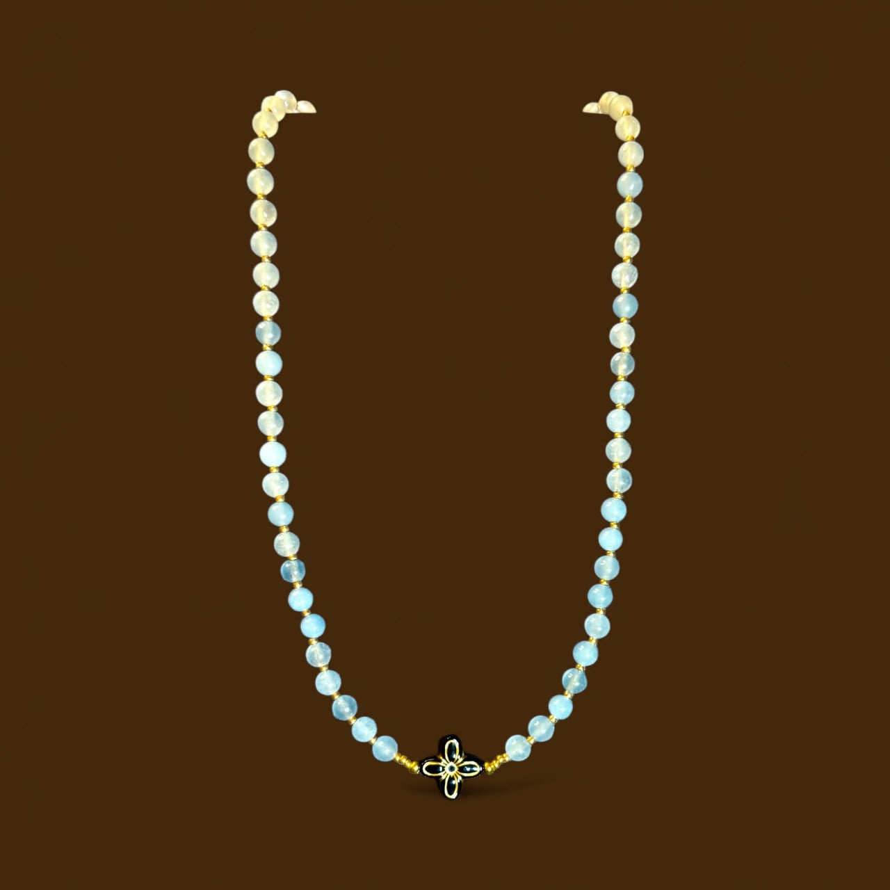 18” Soft Blue Beaded Necklace with Black & Gold Floral Statement Center