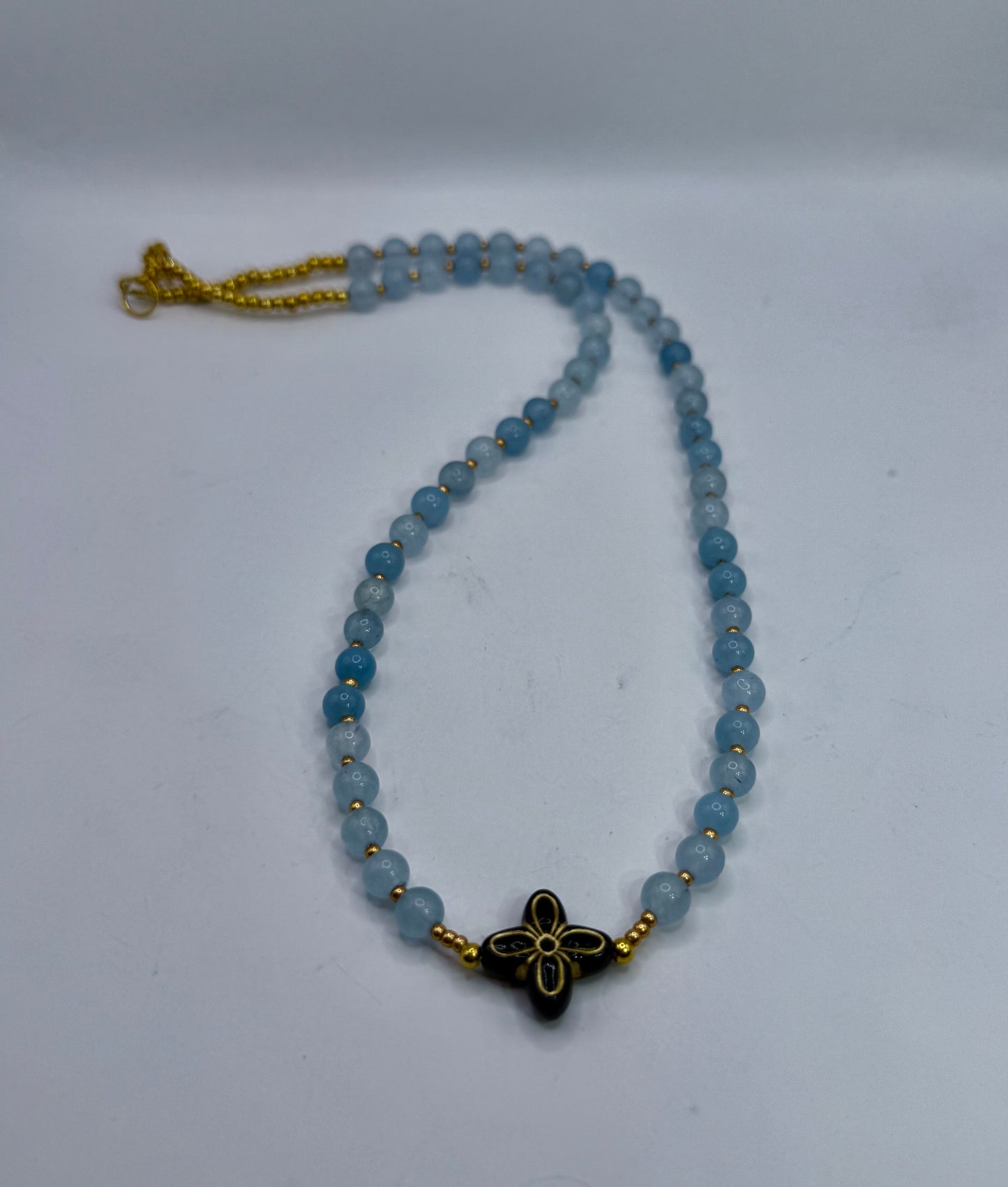 18” Soft Blue Beaded Necklace with Black & Gold Floral Statement Center