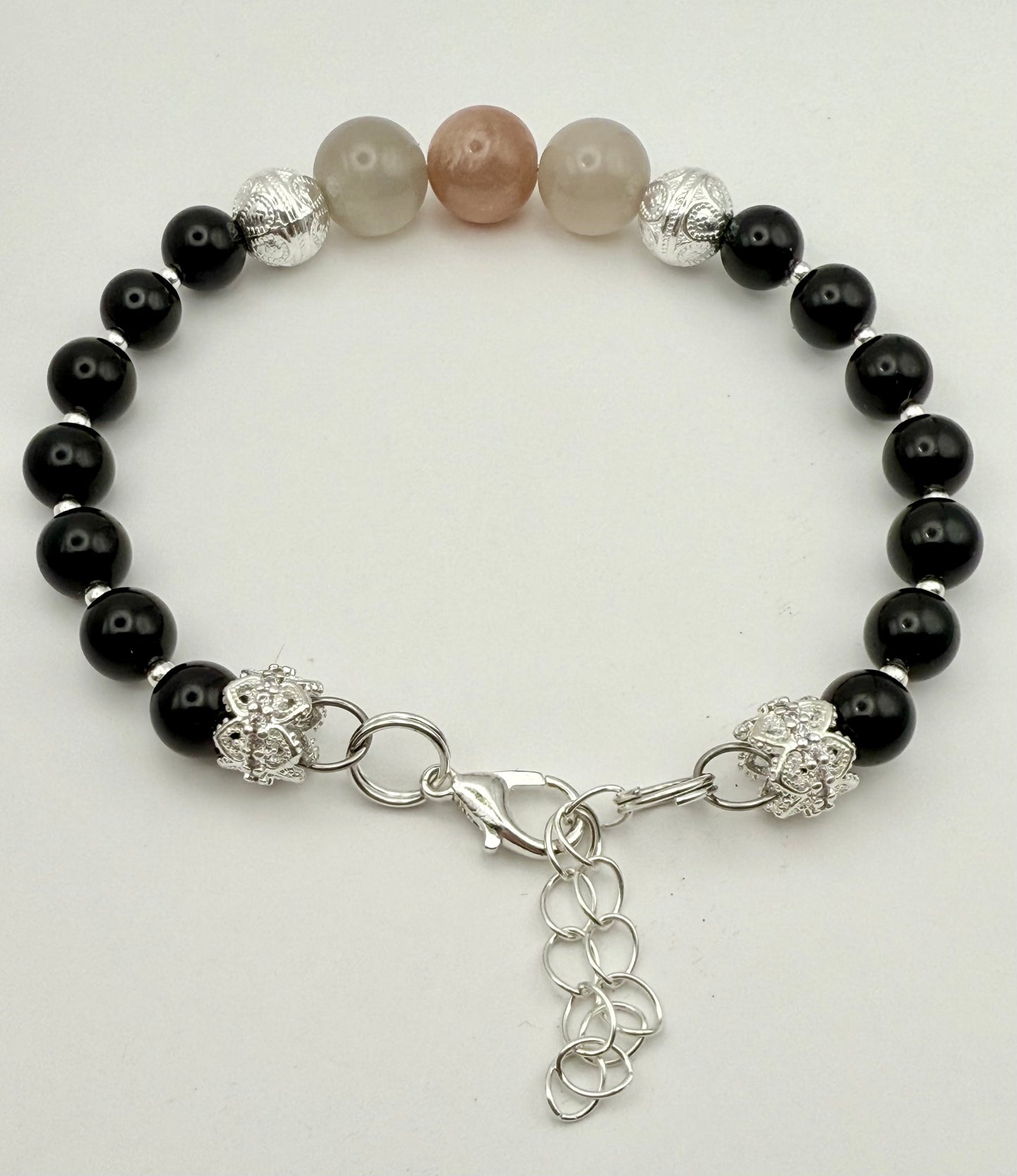 Onyx Bracelet with black and pink moonstone focal 7.25-7.5"