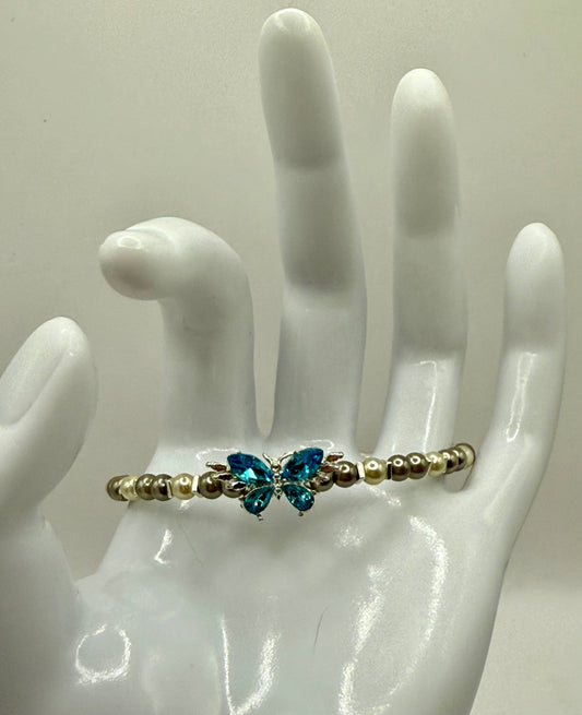 7.5” Ivory & Olive Glass Pearl Bracelet with Blue Butterfly Focal – Nature-Inspired Jewelry