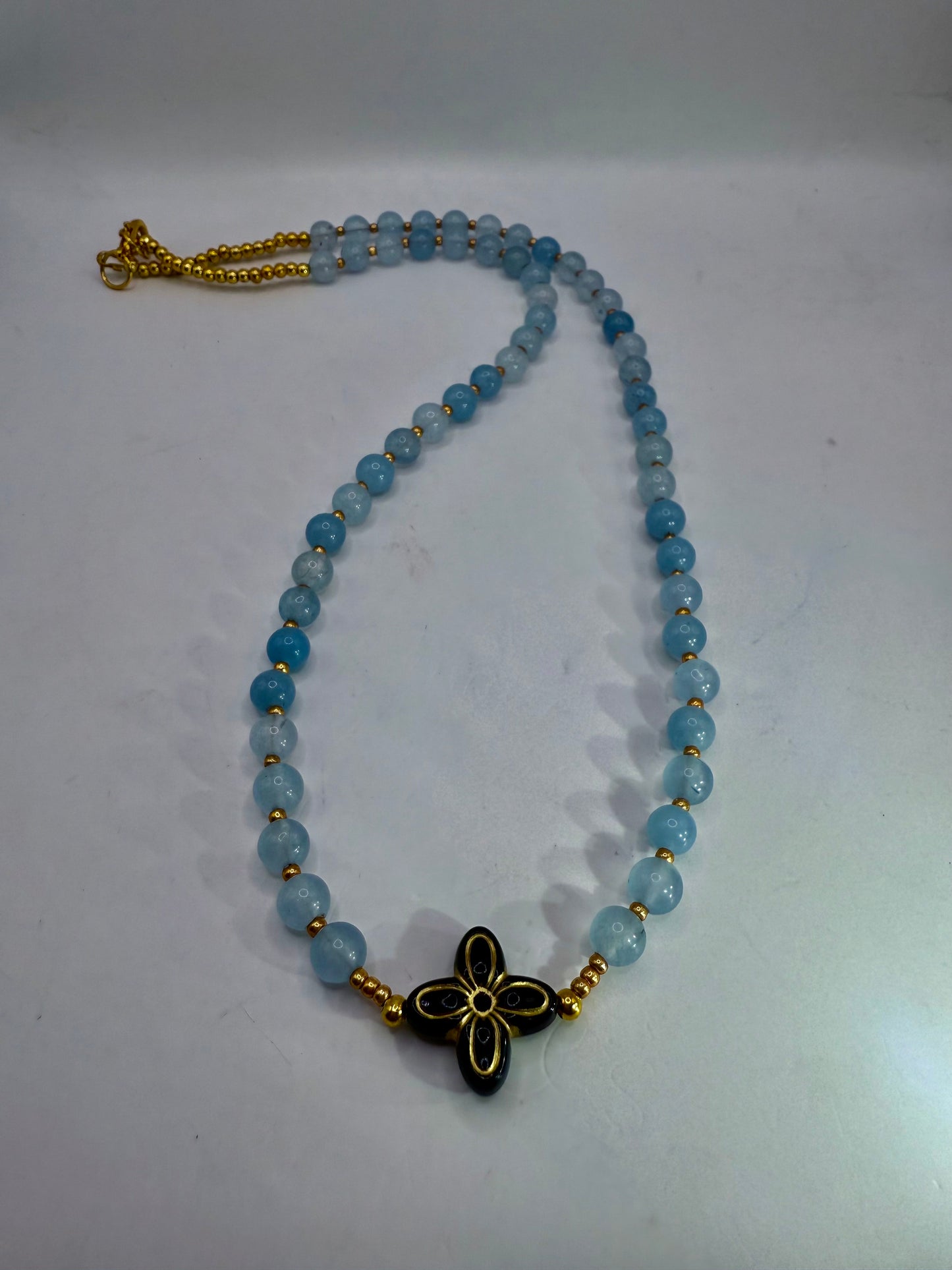 18” Soft Blue Beaded Necklace with Black & Gold Floral Statement Center