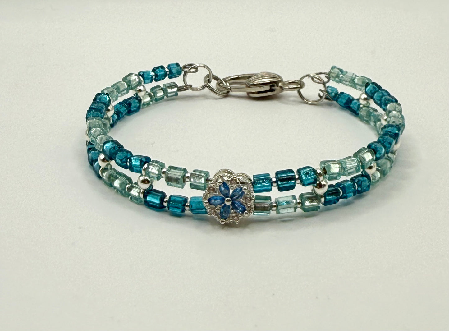 7.5” Aqua & Teal Glass Beaded Bracelet with Silver Flower Focal – Double Strand Clasp Bracelet
