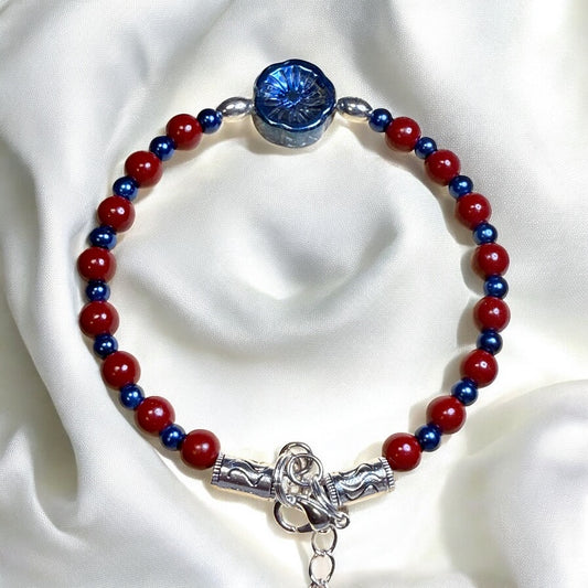 Red and Blue Glass bead bracelet with iridescent electroplated flower focal 7.5"